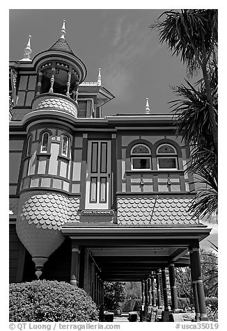 Door to nowhere, opening to a one-story drop. Winchester Mystery House, San Jose, California, USA (black and white)