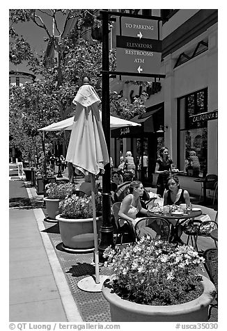 Outdoor restaurant tables. Santana Row, San Jose, California, USA (black and white)