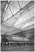 Check-in booth, SFO airport, designed by Craig Hartman. California, USA (black and white)