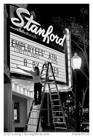 Woman changing movie title, Stanford Theatre. Palo Alto,  California, USA (black and white)