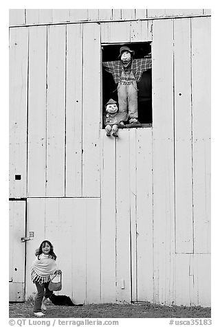 Girl and figures in barn window, Happy Hollow Farm, Rancho San Antonio Park, Los Altos. California, USA (black and white)