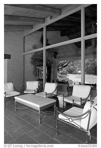 Chairs and coffee table on porch, Sunset Gardens. Menlo Park,  California, USA (black and white)