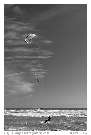 Kite surfers, waves, and ocean, Waddell Creek Beach. California, USA (black and white)