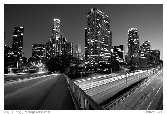 Bridge, Harbor Freeway, and skyline at nightfall. Los Angeles, California, USA