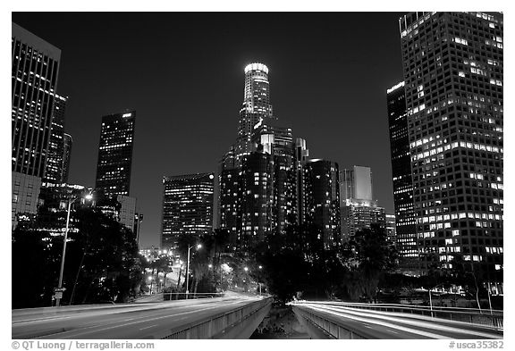 Traffic lights and skyline at night. Los Angeles, California, USA