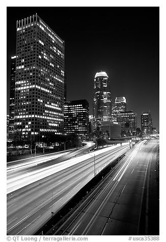 Traffic on Harbor Freeway and skyline at night. Los Angeles, California, USA (black and white)