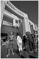 People dressed as movie characters in front of the Kodak Theatre. Hollywood, Los Angeles, California, USA (black and white)