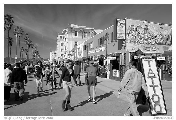 Rollerblading on Ocean Front Walk. Venice, Los Angeles, California, USA (black and white)