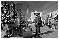 Man selling crafts on Venice Boardwalk. Venice, Los Angeles, California, USA ( black and white)