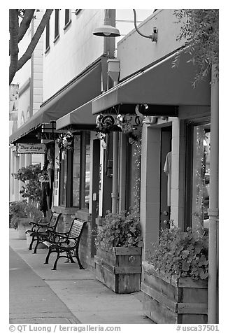 Storefront and public benches on Main Street. Half Moon Bay, California, USA