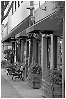 Storefront and public benches on Main Street. Half Moon Bay, California, USA (black and white)