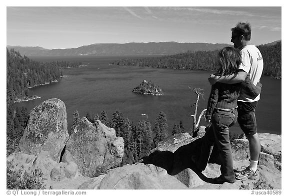Couple standing above Emerald Bay, Lake Tahoe, California. USA (black and white)
