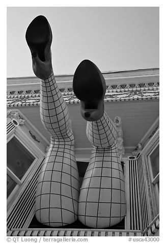 Legs with fishnet stockings hanging from a window, Haight-Ashbury District. San Francisco, California, USA