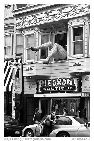 Woman exiting car below women legs with stockings. San Francisco, California, USA