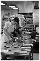 Man preparing pizza, Haight-Ashbury district. San Francisco, California, USA (black and white)
