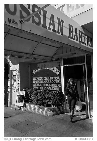 Russian Bakery with redhead woman walking out. San Francisco, California, USA (black and white)