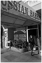 Russian Bakery with redhead woman walking out. San Francisco, California, USA (black and white)