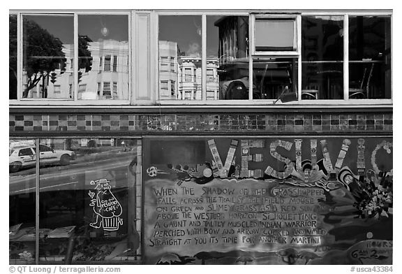 Beatnik area mural and windows with Vesuvio icon and many reflections, North Beach. San Francisco, California, USA (black and white)