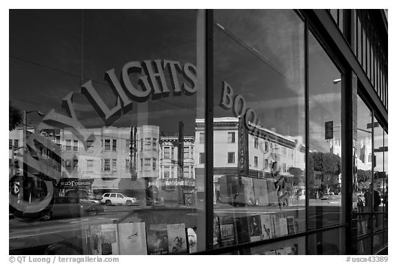 City Light Bookstore window glass and city reflections, North Beach. San Francisco, California, USA (black and white)