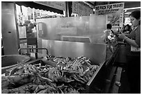 Crabs at outdoor food vending booths, Fishermans wharf. San Francisco, California, USA (black and white)