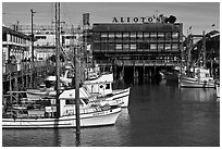 Aliotos restaurant and fishing fleet, Fishermans wharf. San Francisco, California, USA (black and white)