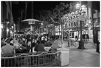 People dining at outdoor restaurant, Third Street Promenade. Santa Monica, Los Angeles, California, USA (black and white)