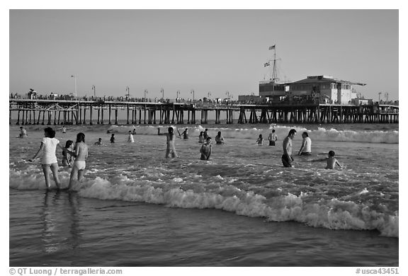 Beach shore and Santa Monica Pier, late afternoon. Santa Monica, Los Angeles, California, USA (black and white)