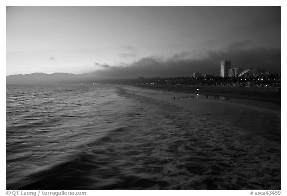 Ocean and beachfront at sunset. Santa Monica, Los Angeles, California, USA (black and white)