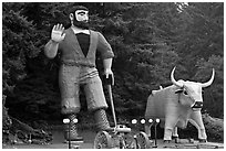 Giant figures of Paul Buyan and cow. California, USA (black and white)