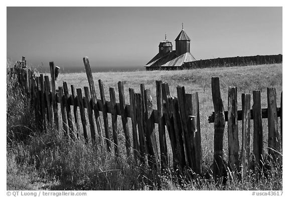 Fences, summer grass and chapel towers, Fort Ross. Sonoma Coast, California, USA