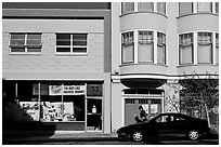 Street with brighly painted buildings, Mission District. San Francisco, California, USA ( black and white)