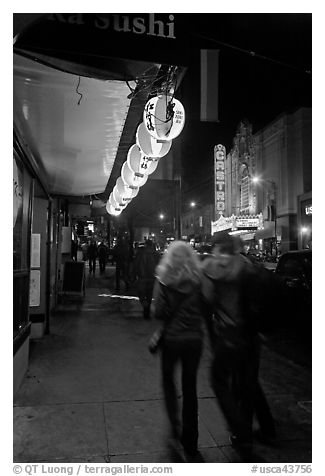 Couple on Castro street at night. San Francisco, California, USA