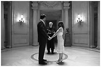 Couple taking marriage wows, City Hall. San Francisco, California, USA ( black and white)