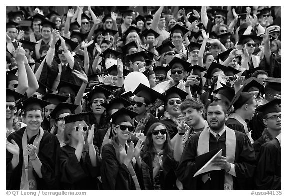 Graduating students wave to family and friends, commencement. Stanford University, California, USA