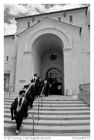 Graduating students in academic robes walk into Memorial auditorium. Stanford University, California, USA (black and white)
