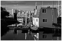 Houseboat and Oakland skyline. Oakland, California, USA ( black and white)