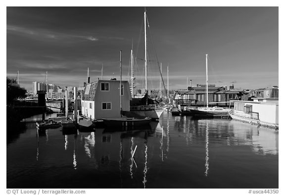 Alameda Houseboats and Oakland skyline. Oakland, California, USA