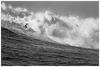 Surfing Mavericks. Half Moon Bay, California, USA (black and white)