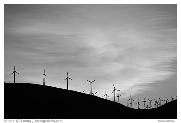 Wind farm silhouetted on hill, Altamont. California, USA