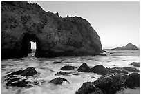 Pfeiffer Beach arch at sunset. Big Sur, California, USA ( black and white)