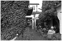 Cafe terrace in alley. Carmel-by-the-Sea, California, USA (black and white)