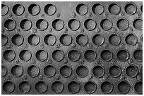 Grid of holes in metal, Shipyard No 3, Rosie the Riveter Front National Historical Park. Richmond, California, USA ( black and white)