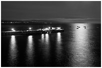 Pier and yachts with moon reflection. Capitola, California, USA ( black and white)
