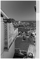 Harbor seen from between hillside houses, Avalon, Catalina. California, USA (black and white)