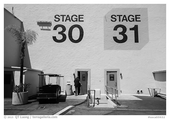 Man entering soundstage, Paramount Pictures Studios lot. Hollywood, Los Angeles, California, USA (black and white)