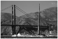 Oracle Team USA AC72 America's cup boat and Golden Gate Bridge. San Francisco, California, USA ( black and white)
