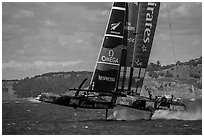 Emirates Team New Zealand Aotearoa catamaran foiling in upwind leg. San Francisco, California, USA (black and white)