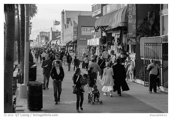 People stroll on Ocean Front Walk. Venice, Los Angeles, California, USA (black and white)