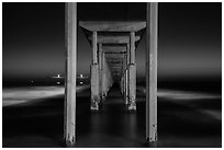 Underside of Ocean Beach Pier at night. San Diego, California, USA ( black and white)