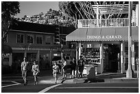 Visitors cross street in shopping area. Laguna Beach, Orange County, California, USA ( black and white)